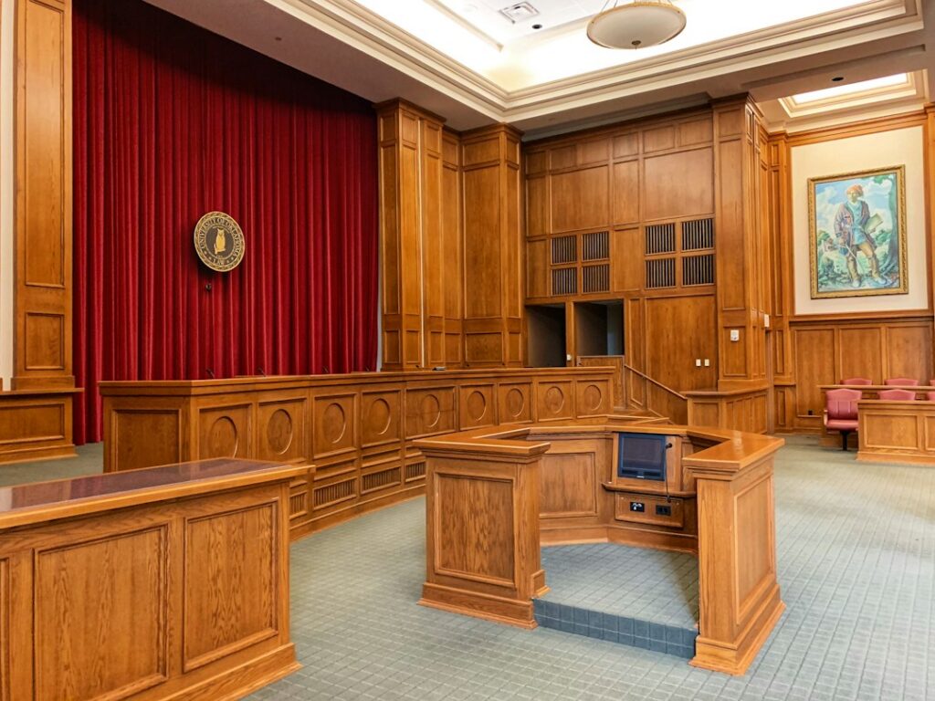 Courtroom interior representing criminal charges, trial procedure and judicial decisions.