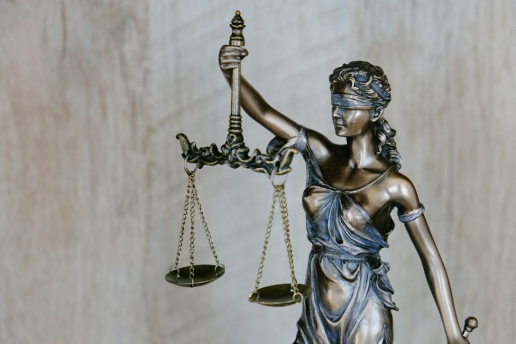 Lady Justice representing effective remedy, fair trial and defence rights under European law.