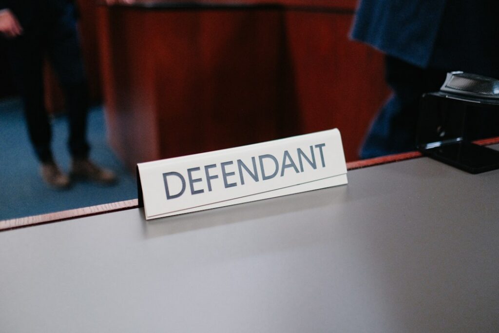 Legal desk and defence materials representing judicial assessment of evidence.