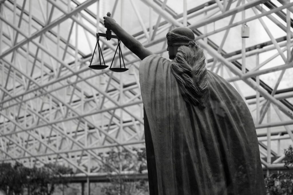 Lady Justice sculpture representing the presumption of innocence and the right to be present at trial.